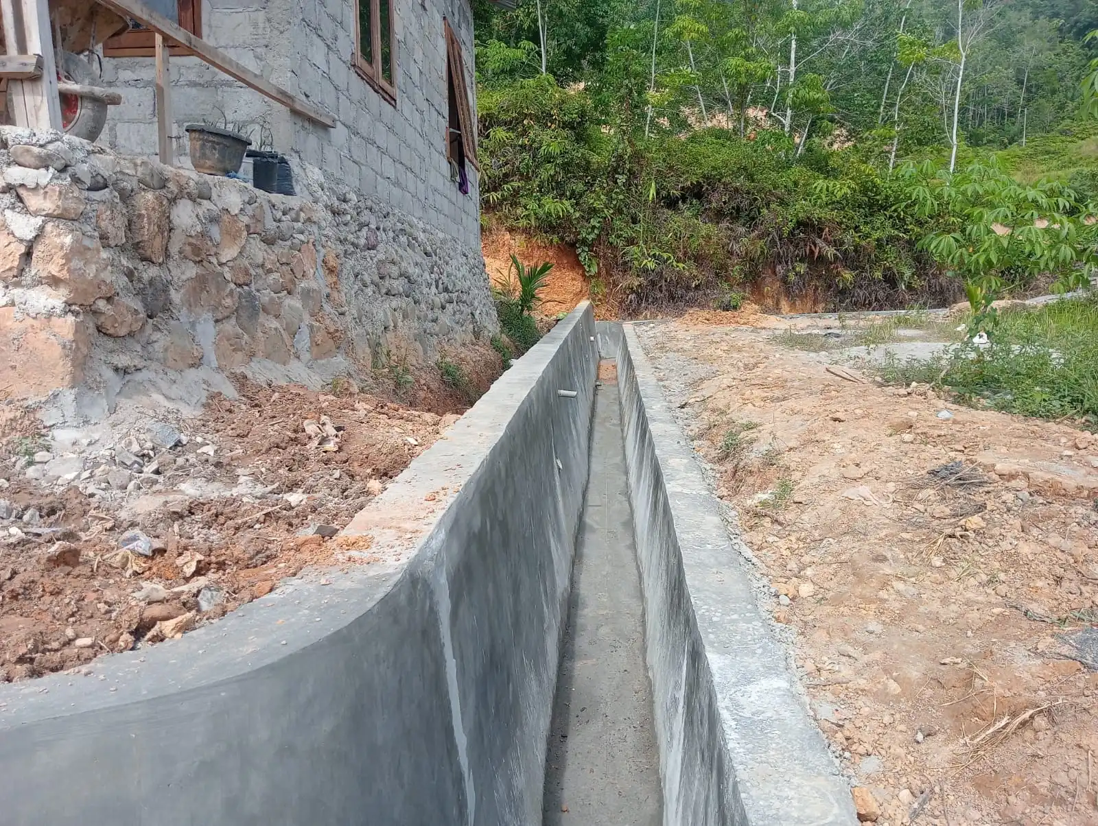 Pembangunan TPT di Desa Sigulang Dilakukan untuk Lindungi Permukiman dari Risiko Longsor